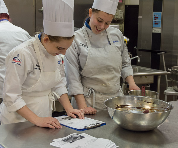 Baking and pastry arts students Rachel A. Henninger, of Bellefonte, and Maren A. Zaczkiewicz, of Williamsport, review a recipe.
