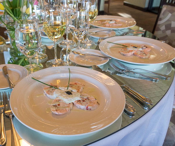 The first course, titled “The First Butterfly of Spring” by Rosenberg, features Alaskan king salmon stuffed with sea scallop and lobster mousse and served with dill crème fraiche, caviar, and Champagne dressing.