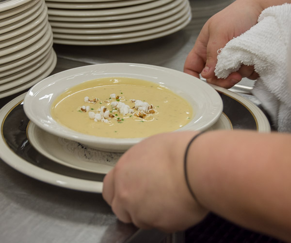 The second course: sharp cheddar popcorn bisque, was a popular menu item at Lambeau Field in Green Bay, Wis. – and a favorite among Visiting Chef Dinner guests.