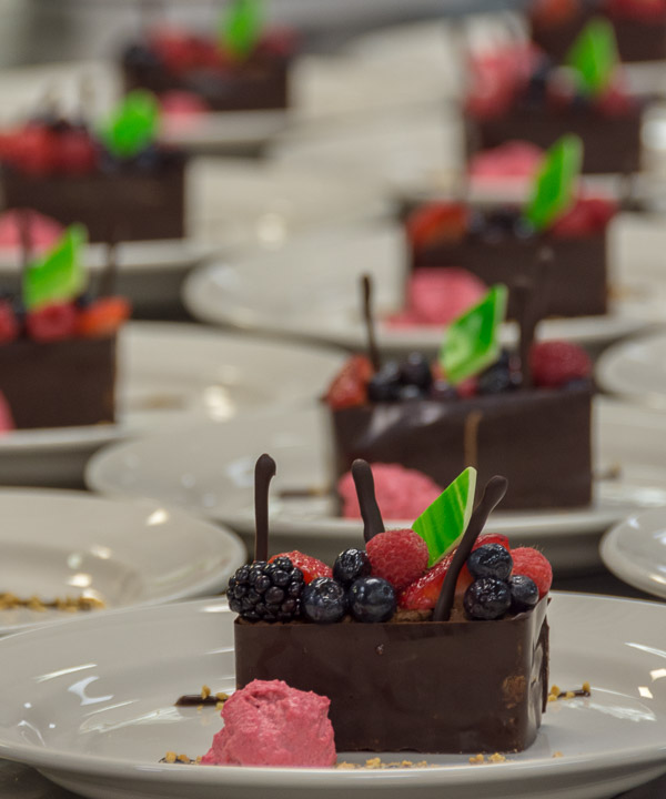 The evening’s dessert: a chocolate mousse box filled with fresh berries, apricot glaze and chocolate batons and served with raspberry quenelle. 