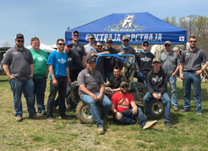 Members of the Penn College Baja SAE team take a well-earned break during their April competition in Maryland. Standing from left are: Myron D. Milliken, Lewistown; Matthew J. Nyman, Lock Haven; Todd R. Mercer, Williamsport; Dylan A. Bianco, State College; Christopher M. Schweikert, Jamison; Mathias Decker, Farmington; Shujaa AlQahtani, Saudi Arabia; Trevor M. Clouser, Millmont; Daniel M. Gerard, Doylestown; Joshua J. Cover, Selinsgrove; adviser John G. Upcraft; and Jonathan R. Sutcliffe, Orangeville. Sitting on the car from left are: Logan B. Goodhart, Chambersburg; Johnathan T. Capps, North Wales; and Mark A. Turek, Red Lion. Sitting on the ground is alumnus Zach Mazur, who started the college’s Baja SAE team in 2005. 