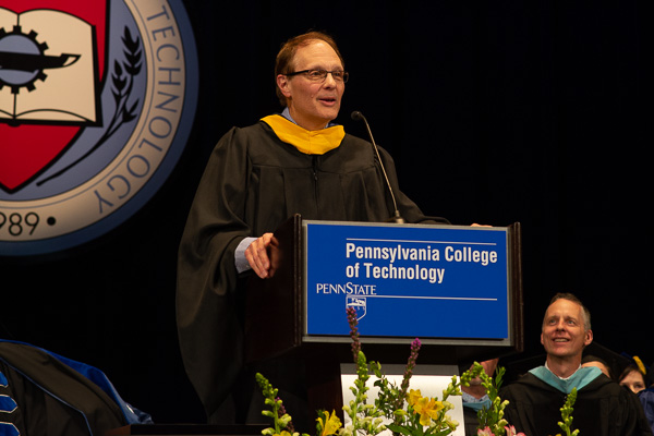 A surprised Edwin G. Owens addresses the audience (along with his joyful and proud dean, Michael J. Reed, at right).