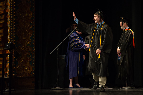 Roman J. Scicchitano, graduating with a bachelor's in electronics and computer engineering technology, waves to his fan base. He earned a degree in electronics and computer engineering technology: robotics and automation emphasis in 2015.