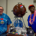 Bernice C. Weaver (left), of Newville, enrolled in the residential construction technology and management: building construction technology concentration, joins Dining Services' Denise M. Rhodes at the prize table.