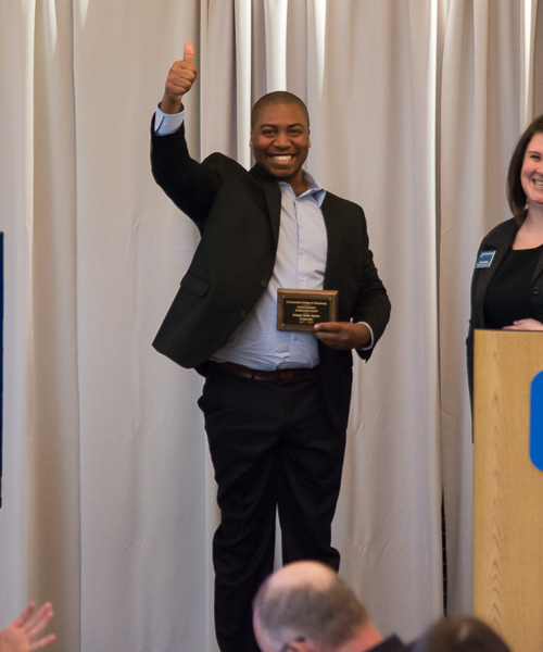 It was a big night for the Omega Delta Sigma veterans fraternity, represented for one of its many awards by Efrem K. Foster. Adding to the smiles is Allison A. Bressler, assistant director of student activities for programming and Greek life.