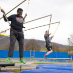 Testing their mettle on the bungee jump are (from left) Carlos J. Roddy, a pre-nursing major from Williamsport, and Calvin E. Anderson, of Wellsville, enrolled in engineering design technology.