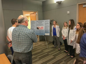 Detailing their research on proper endotracheal tube measurement are (from left) Shelby D. Lyter, Jessica H. Barchik, Ashley N. Nakach and Ashleigh M. Modispaw. Not visible in photo, but part of the team, was Chloe F. DeVillars, of Bradford.