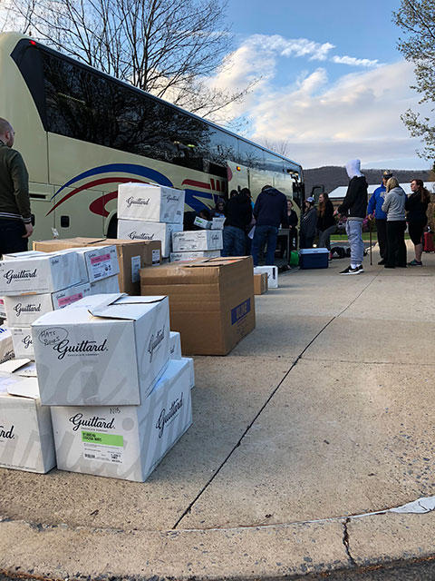 In addition to their personal belongings, the 28 hospitality students and 10 alumni transport 40 boxes of Guittard Chocolate on the 11-hour bus ride to Louisville, Ky. The chocolate will serve as the key ingredient for decadent desserts at Churchill Downs’ exclusive clubs and suites.