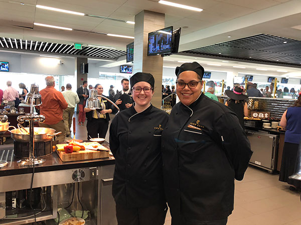 Cynthia R. Setzer (left), of Port Allegany, and Amaris T. Smith, of Williamsport, are all smiles after serving guests at the Turf Club.