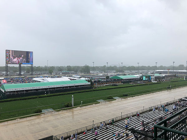 A late-morning shower portends the wettest Kentucky Derby in history. 