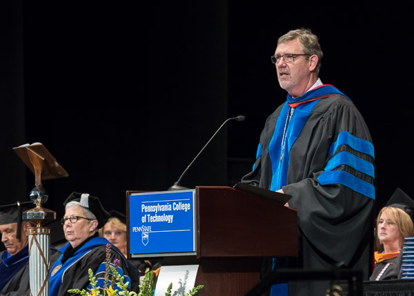 Paul L. Starkey, vice president for academic affairs/provost, presents the graduates for the president's official concurrence.