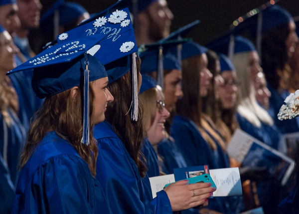 On a happy day, only the gowns are blue for these associate-degree graduates.
