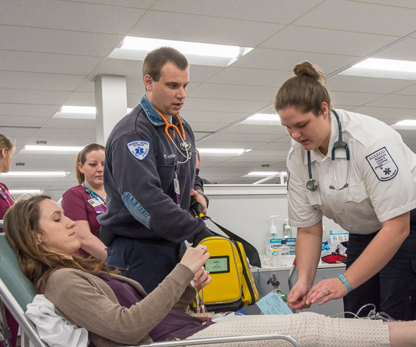 In the dental hygiene clinic, emergency medical services students Matthew S. Walter, of Mifflinburg, and Sarah A. Zimmerman, of Turbotville, are called to action when “patient” Season C. Whitenight, a physician assistant student from Bloomsburg, experiences anaphylaxis during her exam.