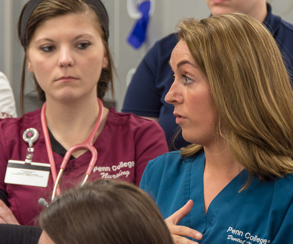 In the dental hygiene clinic, Madyson N. Stiehler, a student in the dental hygiene: health policy and administration concentration, discusses actions that dental hygienists take when complications occur during an appointment.