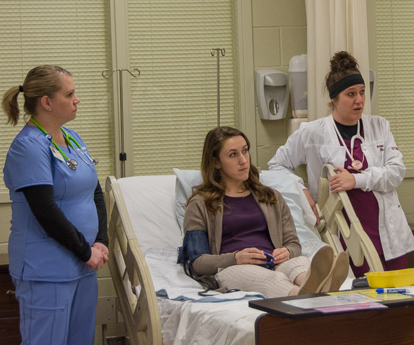 Nursing students discuss their role in the event’s designated emergency department.