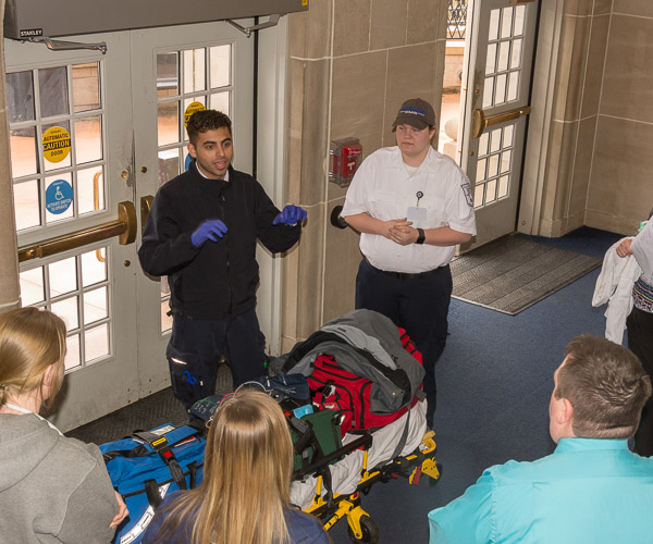 Emergency medical services students Ali T. Alnasir, of Williamsport, and Rachel L. Miller, of Mill Hall, talk with students from other majors about the actions they would take when called to a case of “syncope” – brief loss of consciousness – in the Klump Academic Center.