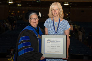 Joanna K. Flynn, associate professor of mathematics, was presented with the highest honor accorded to Penn College faculty – the Veronica M. Muzic Master Teacher Award – at Spring 2018 Commencement. She is shown here with Penn College President Davie Jane Gilmour.