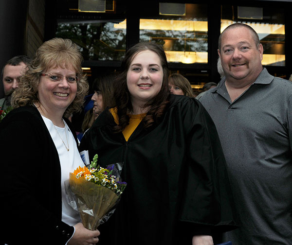 Marketing grad Alexa R. Kopp celebrates with parents Jaimee L. and Terry L.