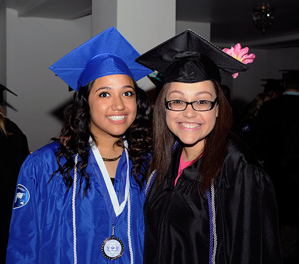 Saturday morning's speaker (right) with friend Leslie M. Medina, who graduated in dental hygiene