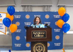 Tracy L. Brundage addresses a Keystone College audience Wednesday after a streaming-video announcement of her selection as that institution's president.