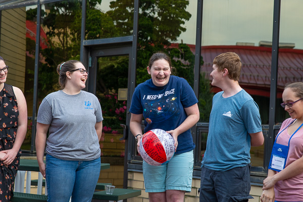 Laughter fills the air as Connections Links (orientation leaders) and high school students participating in the Autism Spectrum Postsecondary Interest Experience enjoy a social activity on the Keystone Dining Room’s outdoor patio.
