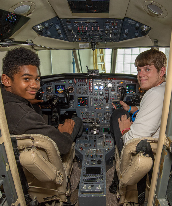 Aviation campers check out the cockpit of the college’s twin-engine Dassault Falcon 20 business jet.