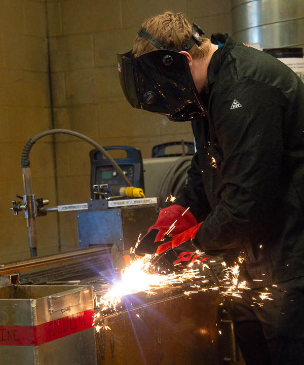 Sparks fly in the welding lab.