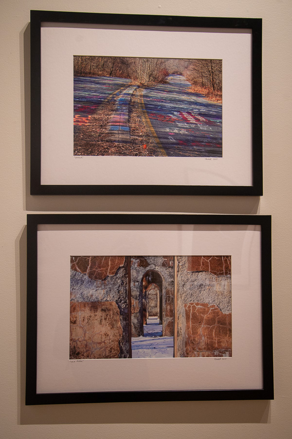 Two photos by Michael Hower deck a wall. The lower one, “Lock Ridge,” received the President’s Award. The artist was unable to attend the opening event. 