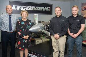 From left, acknowledging a Lycoming Engines gift of 15 aircraft engines to Penn College are Walter V. Gower, assistant dean of transportation and natural resources technologies, and Loni N. Kline, vice president for institutional advancement. Representing Lycoming Engines are Gregg Shimp, vice president of integrated operations, and Christopher Gayman, supervisor of product support (and a Penn College alumnus).