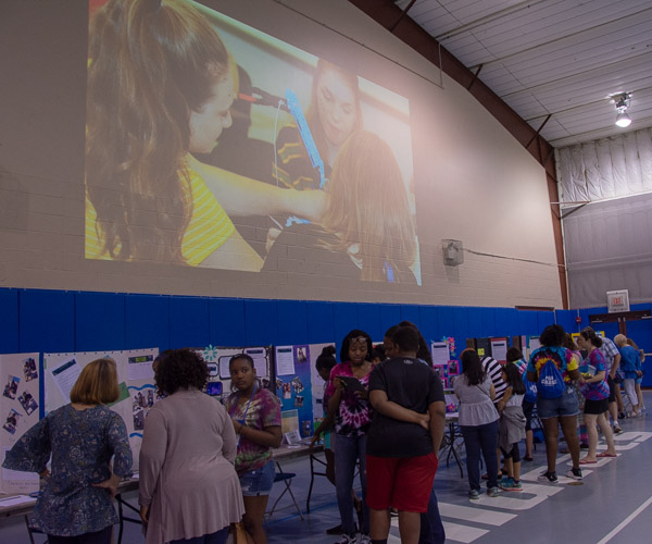 During the SMART Girls Showcase, campers’ posters show off their resumes, the results of an interest inventory and research on a variety of careers.