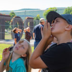 While tempted to use their hands, these competitors were challenged to move a cookie from forehead to mouth by facial movement alone.