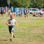 In full stride, a youngster runs his leg of the Alphabet Saltine Challenge.