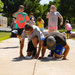 In the Skittles Race, each participant had to hold a straw in his or her mouth, suck a Skittle to the end and run to the bowls to drop their candy cargo. The team with the most Skittles at the end of five minutes won.