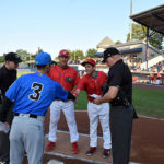 ... and shaking hands with Renegades skipper Blake Butera in a pregame meeting at the plate.