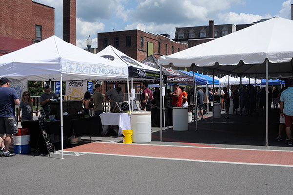 On a sunny, sunny Saturday, tents provide shade and vendors supply ample refreshment.