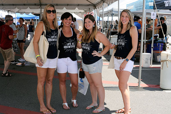 Uniformly expressing an oft-heard Saturday sentiment is an entourage that includes Ashley R. Hilfiger (second from right), a 2010 technology management alum. 