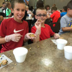 Camp buddies partake in show-and-tell snacking.