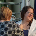 Jennifer L. Mitchell, of Kulpmont, flashes a smile at the audience as she is “pinned” by Elizabeth Bendas.