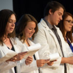 Elizabeth A. Belz, of Montoursville; Hannah M. Frantz, of Hershey; Dylan C. Griffin, of Milton; and Amber L. Grimm, of Milton, join classmates in reciting the physician assistant oath.