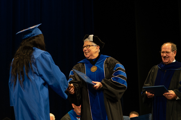 The joy of being a college president is evident on Gilmour's face … and that of Young, her colleague in diploma delivery.