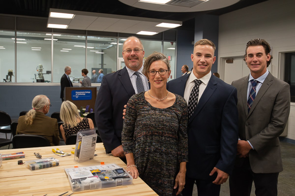 Student architectural designer John A. Gondy (second from right) is joined at the special event by his parents and a brother.