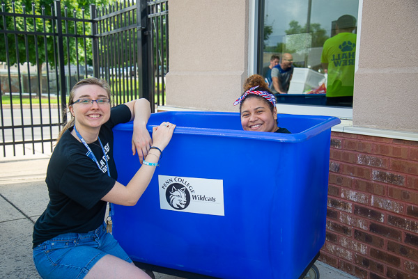 Enjoying a respite in the shade (and in the bin) are Resident Assistants Amber L. Way (left) and Rossell Burgos. Way is an occupational therapy assistant student from Port Matilda. Burgos, of Hazleton, majors in architectural technology. 