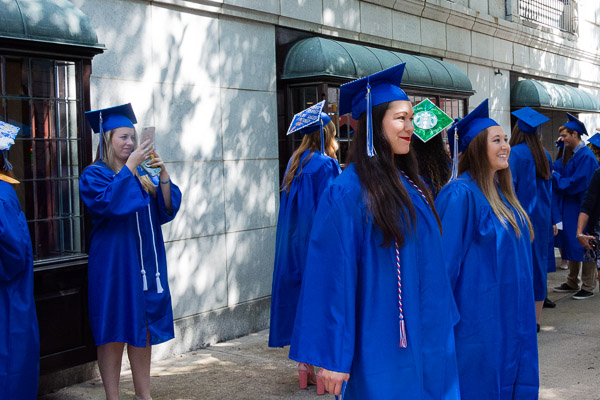 Grads face every which way in downtown's impromptu photo studio.