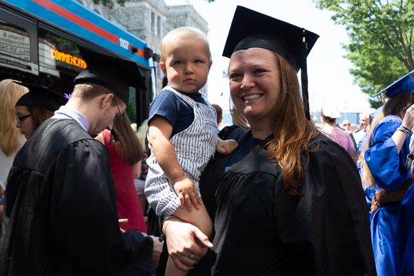 Physician assistant graduate Abbey L. Bower celebrates with her son. 
