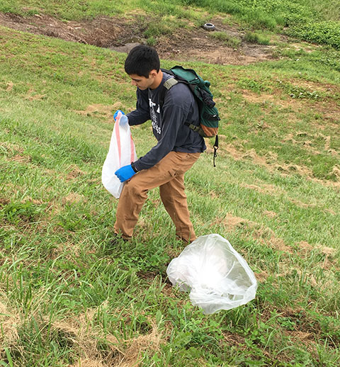 CPE Samuel J. Pham, an aviation maintenance technology major from Camp Hill, covers some territory during cleanup ...