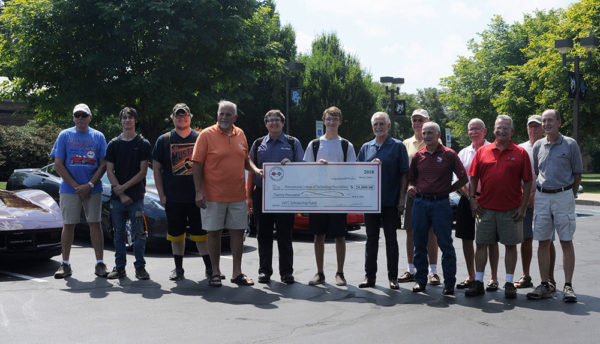 Members of the Susquehanna Valley Corvette Club deliver a scholarship check and join the four latest Penn College students to receive awards from the fund. From left are Ray Harmon; students Jordan W. Boop, of Williamsport, and Logan K. VanBlargan, of Bloomsburg; Kim Walker; students Alex H. Romas, of Collegeville, and Brady K. Collins, of Catawissa; Al Clapps, chair of the club’s car show committee; Bill Alsted; Paul Butters; Jim Campbell; Dave Cappa; Ed Moore and Jack McDermott.