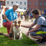 Making friends, one by one, is Poppy, owned by Robert A. (shown) and Carol A. Lugg, dean of construction and design technologies.
