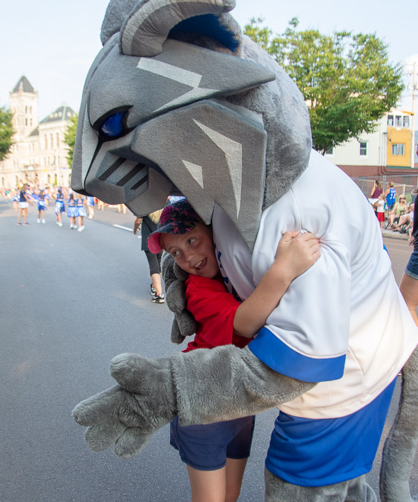The Wildcat grants many requests for hugs during the parade.