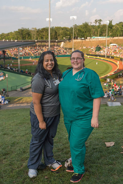 Penn College physician assistant students Kavitha R. Kolangaden (left), of Belle Mead, N.J., and Jaclyn L. Casey, of West Chester, serve a shift at the 2017 Little League World Series, where they helped staff the infirmary in the residential area where competing teams stay.