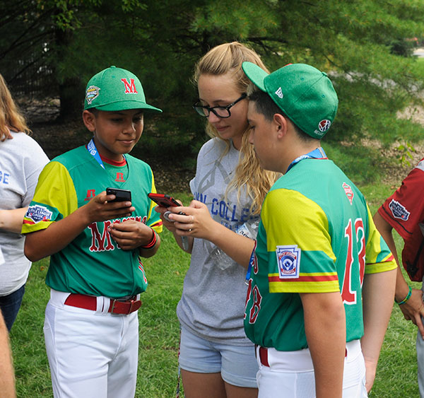 Technology helps make the world smaller for Mexican Little Leaguers and student volunteer Emily K. Conklin, a dental hygiene major from Port Allegany.